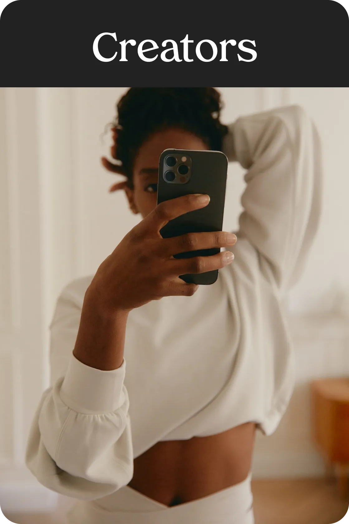 content creator taking a mirror selfie