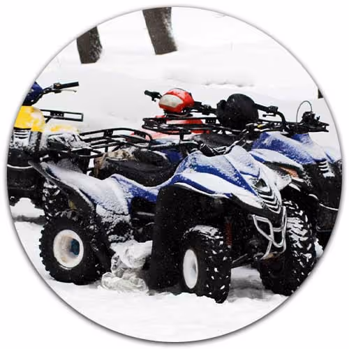 atvs lined up in snow - ATV Insurance concept