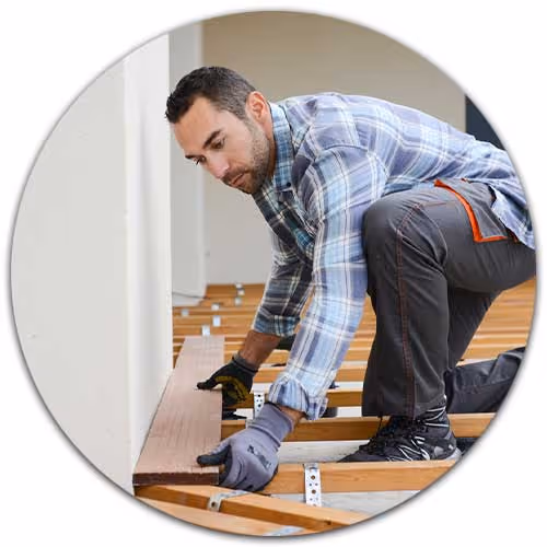 man installing wood floors - Contractor's General Liability Insurance concept