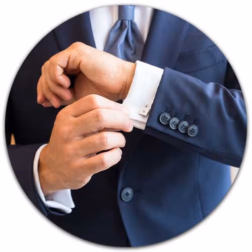 man with suit showing cufflinks - High Net Worth Insurance concept