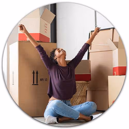 woman happy while unpacking boxes - Renters Insurance concept