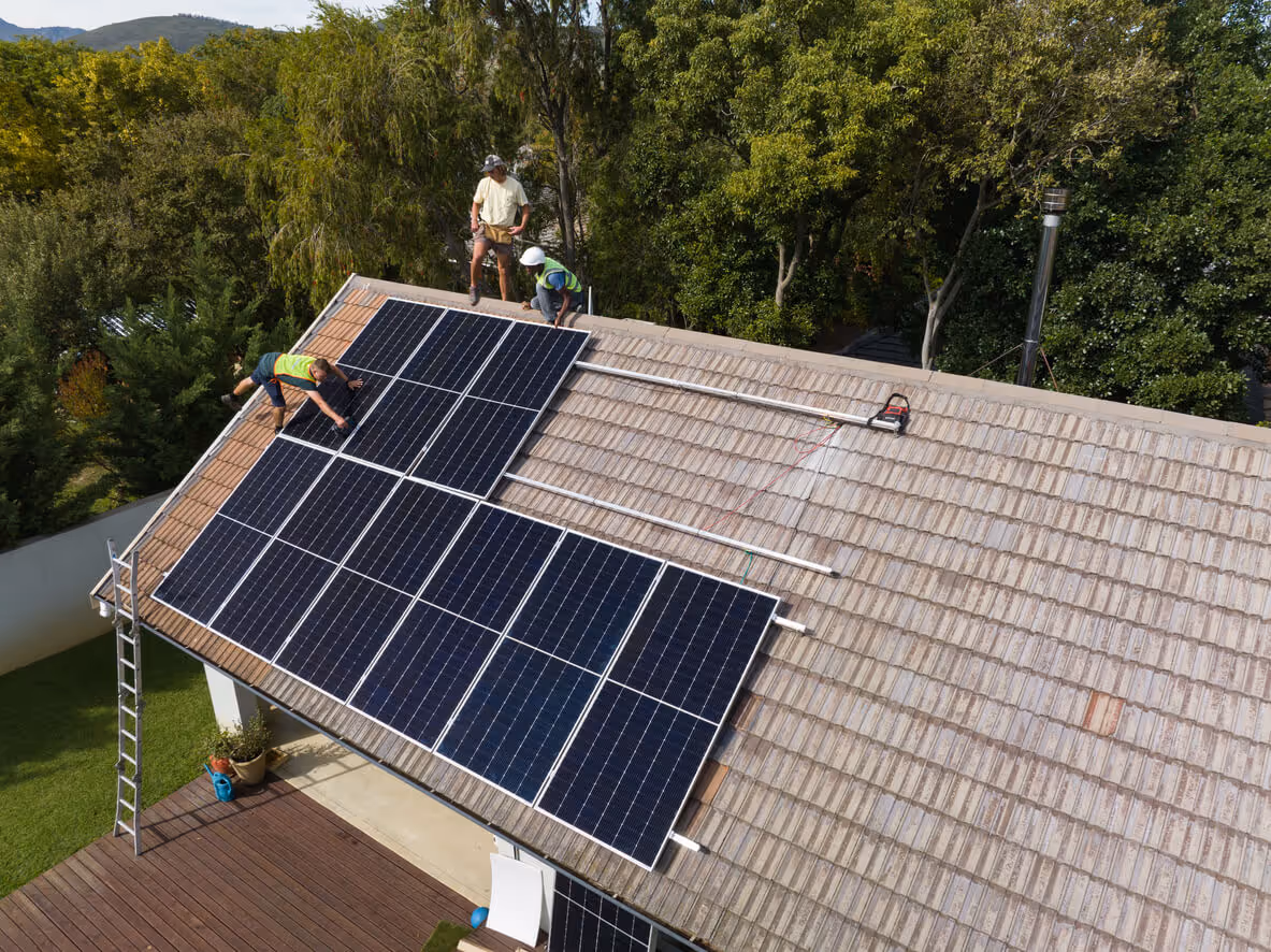 Contractors installing Solar Panels on a Suburban Western USA Home