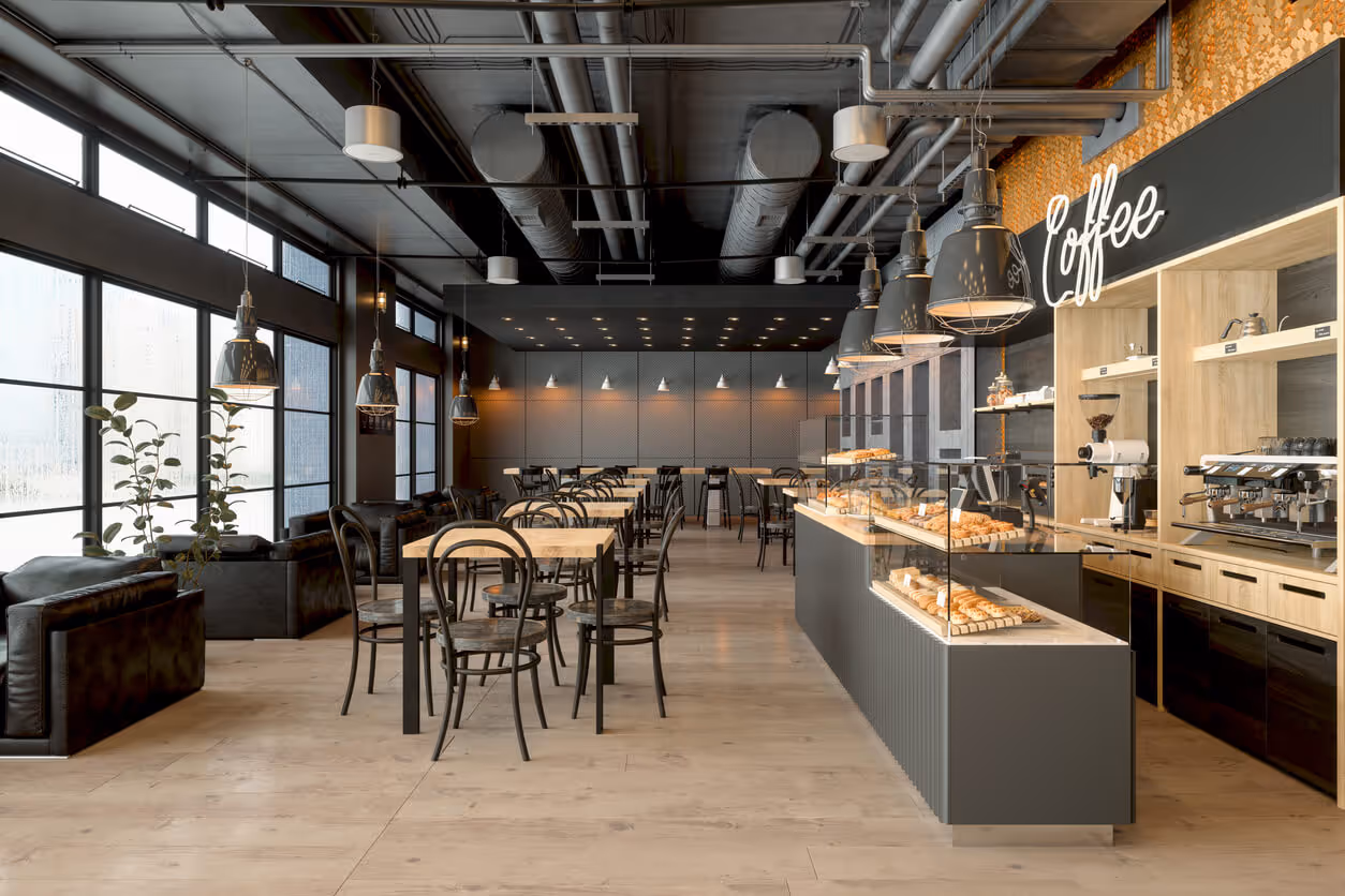 NH Commercial Restaurant Insurance concept - Empty Coffee Shop Interior With Wooden Tables, Coffee Maker, Pastries And Pendant Lights