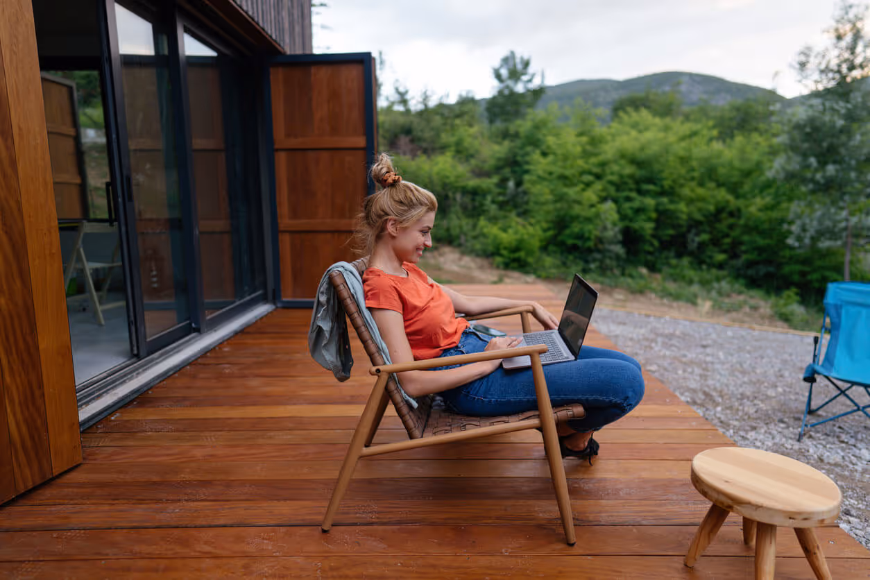 NH Airbnb Insurance concept - Working from a remote location on lap top