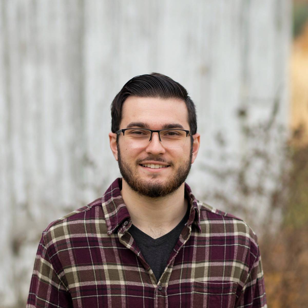 Person holding out hand with iPhone X floating above it