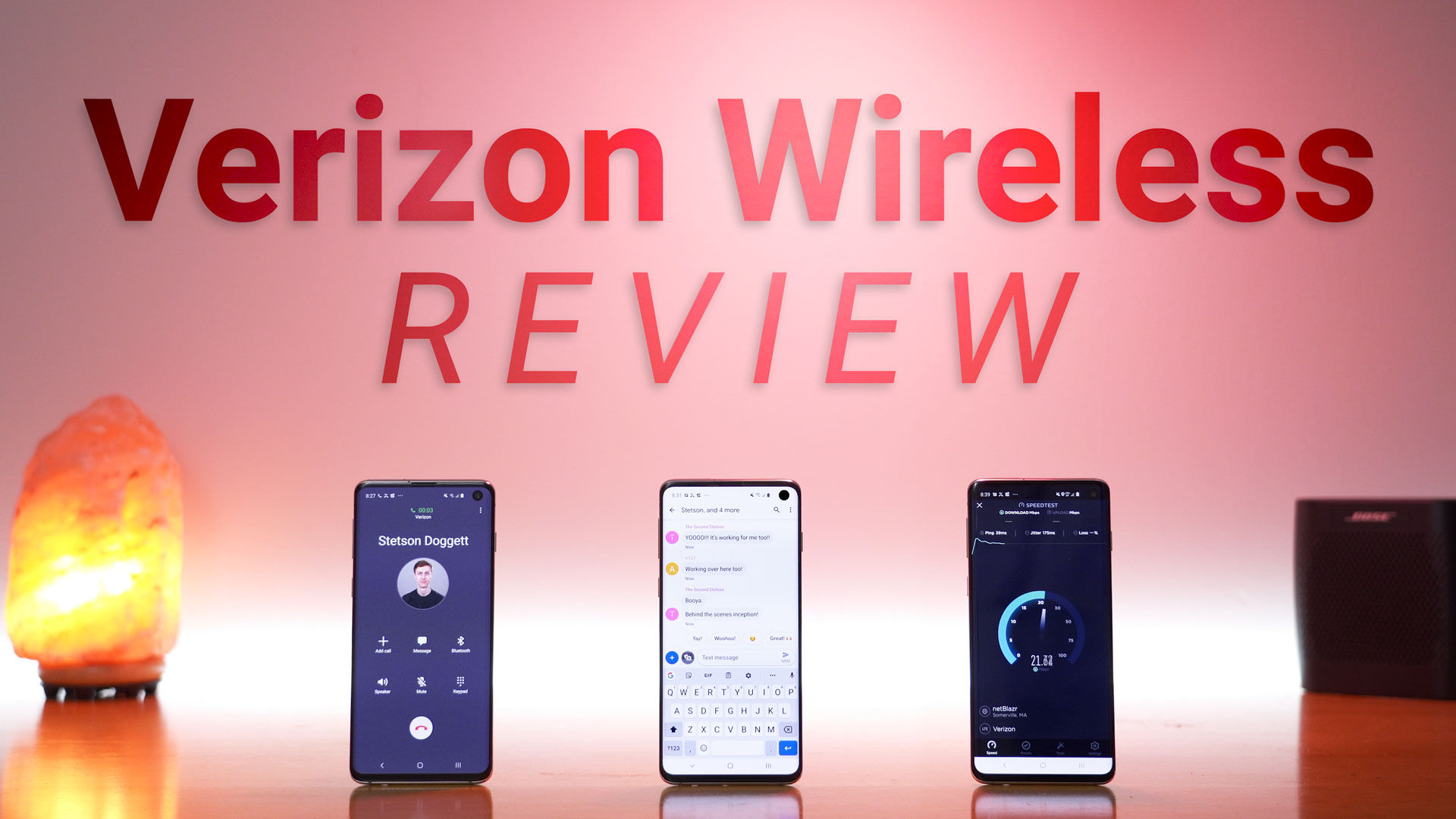 Three phones on a desk making a phone call, sending and receiving SMS messages, and performing a cellular data speed test