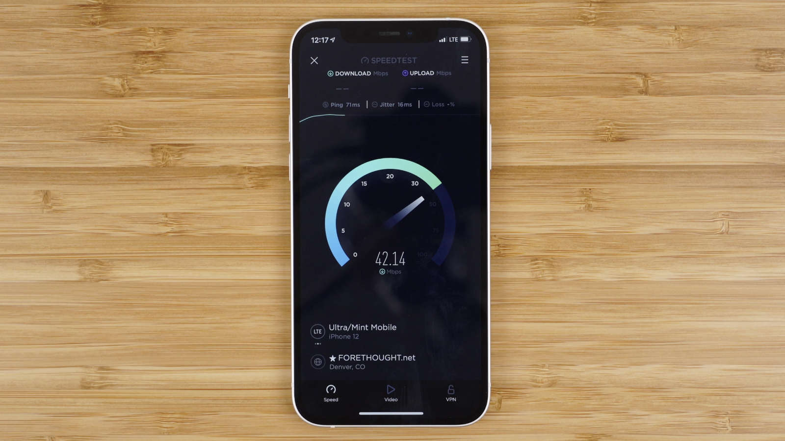 iPhone running cellular data speed test using Ookla's speedtest application