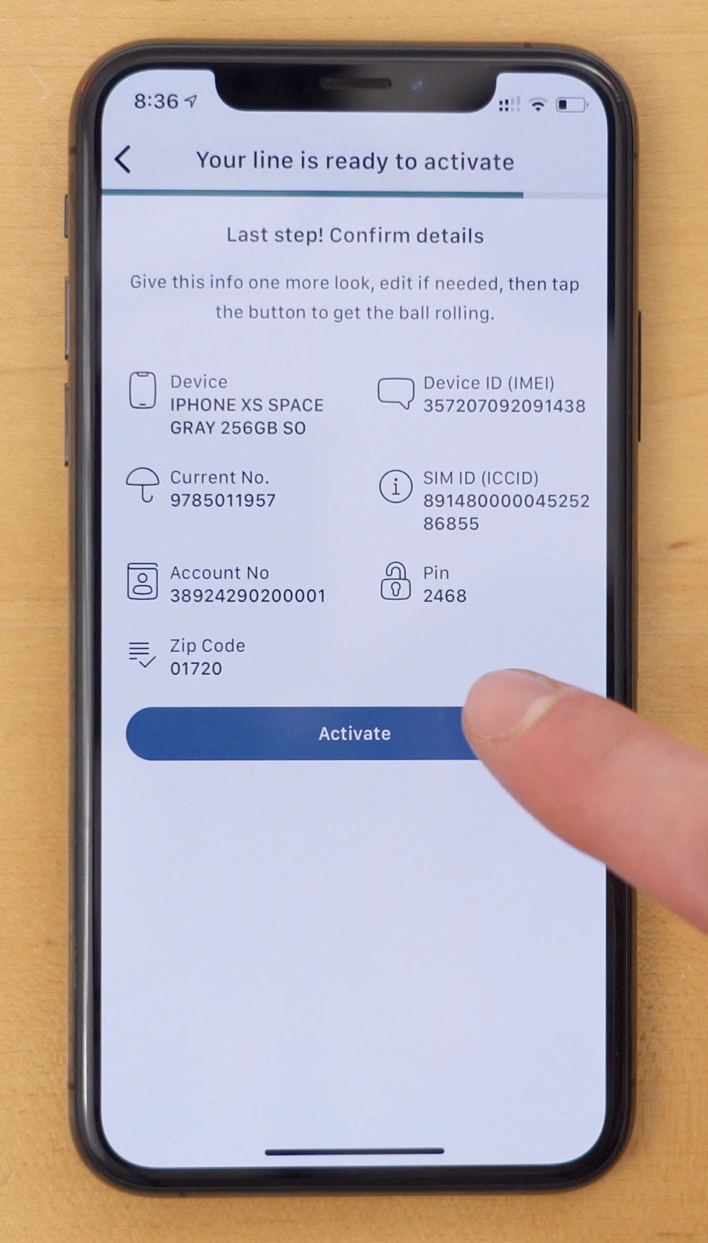 photo of screen on Reach Mobile iPhone app giving users option to confirm their details before activating their line during the activation process