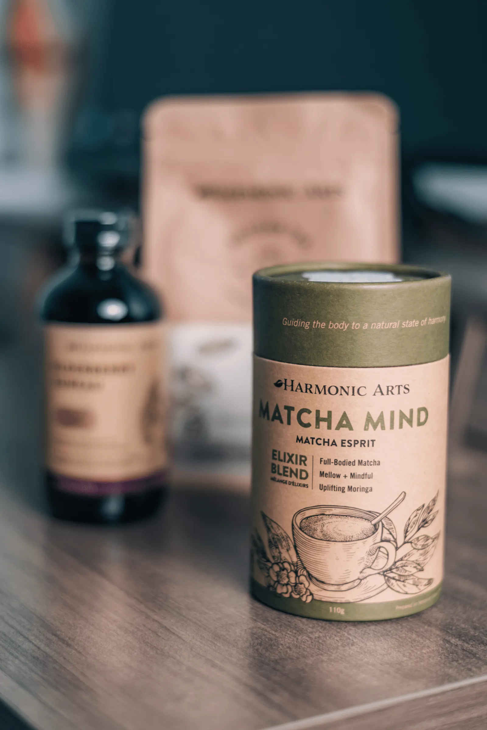 A collection of herbal wellness products, including a "Matcha Mind" tea blend and supplement bottles.