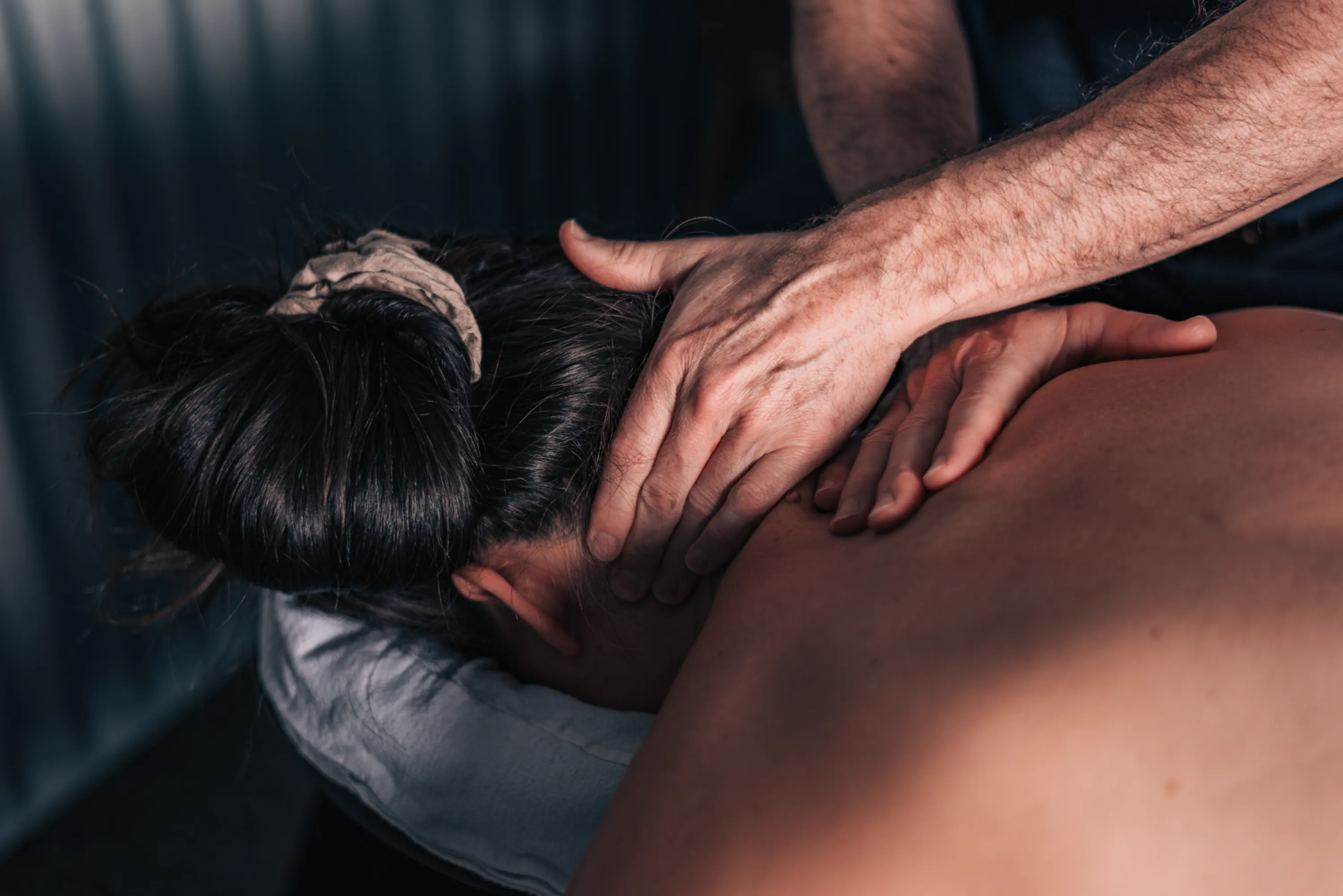 A person receiving a therapeutic back massage.