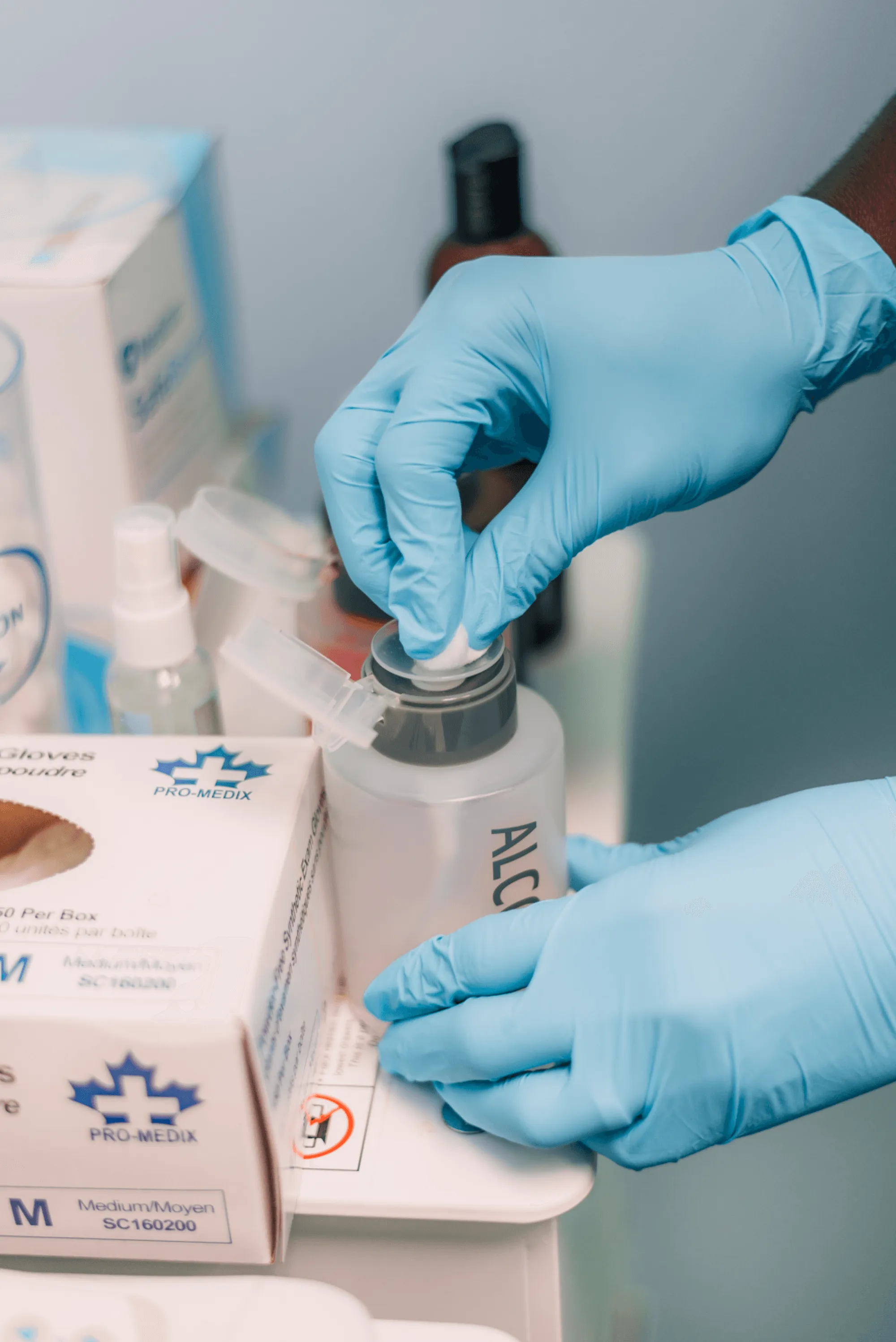Gloved hands handling a medical device