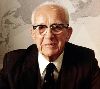 Buckminster Fuller wearing a suit and tie.
