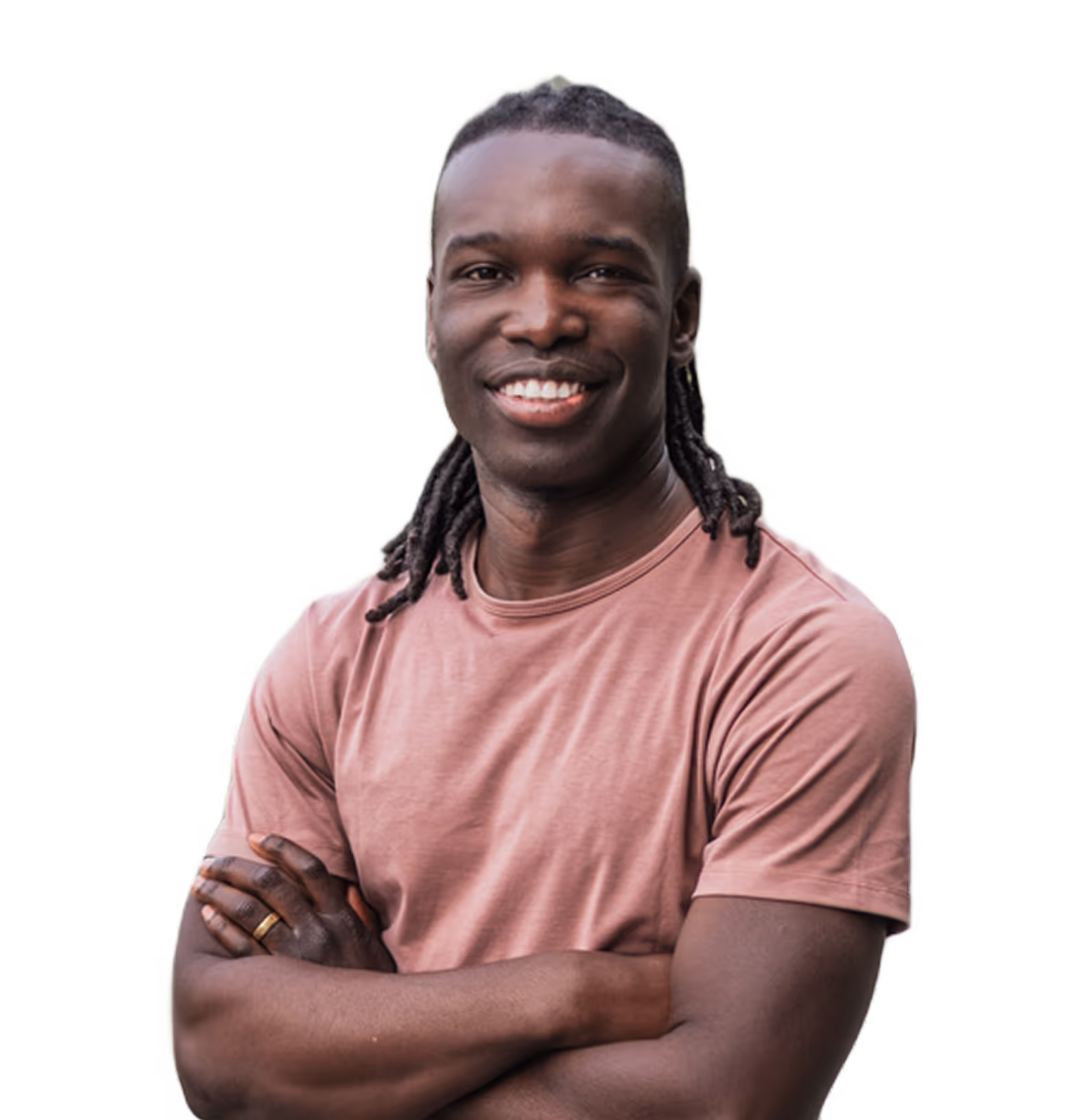 Dr. Ryan Lewis with dreadlocks standing with his arms crossed.