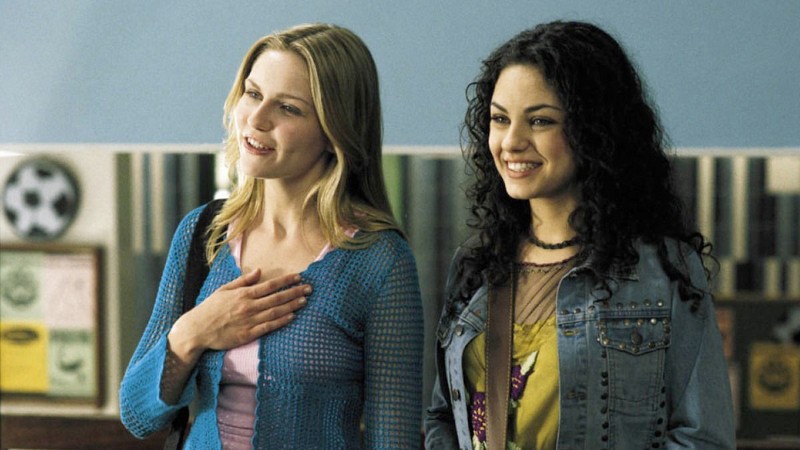 Movie still from Get Over It. Two teen girls smile at school.