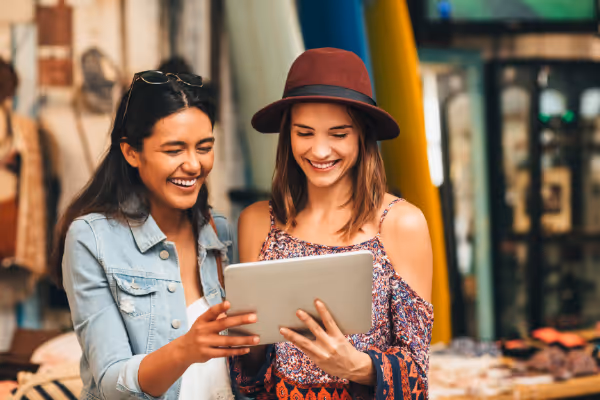 Two customers enjoying getting rewards