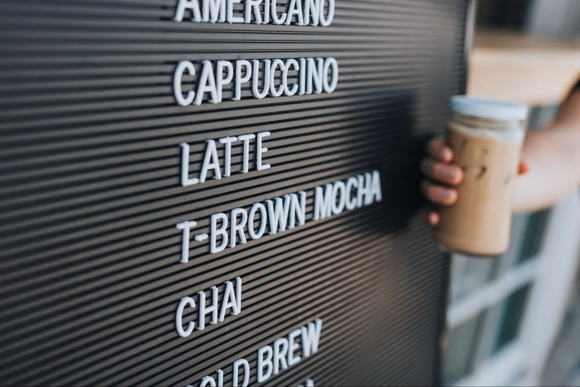 Menu list displaying various types of coffee, showcasing the café's drink offerings