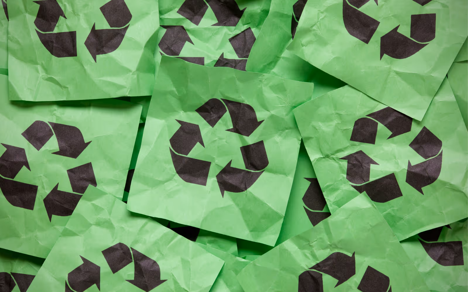 Green and black recycle signs.