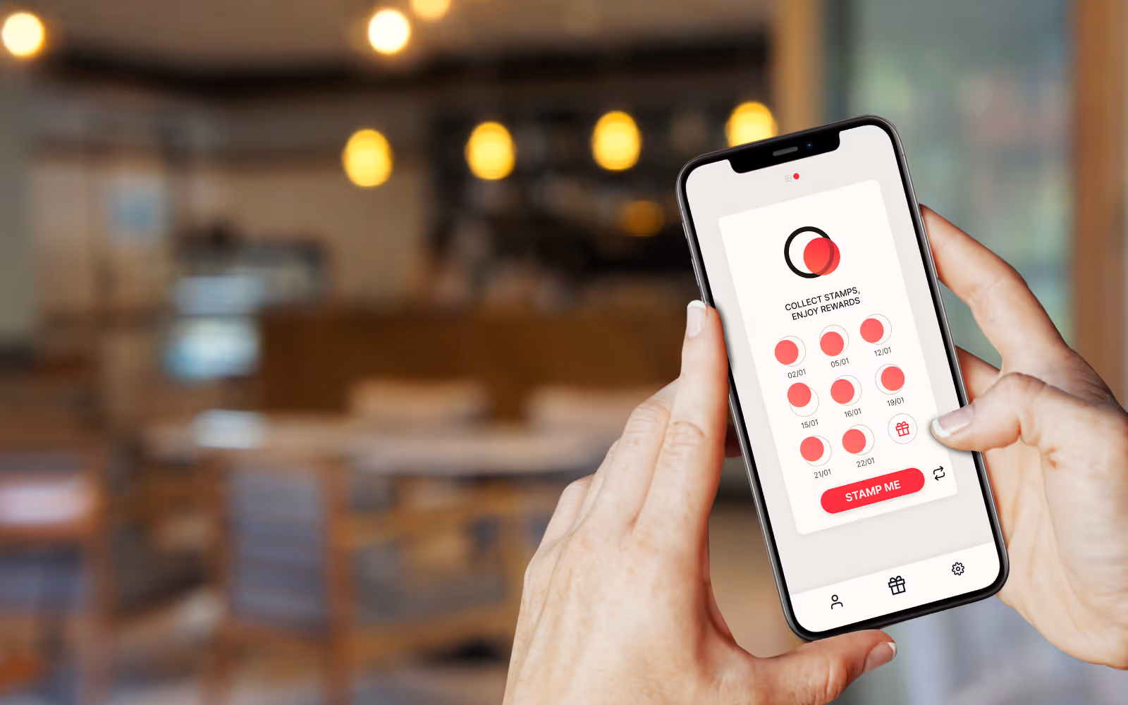 Hands holding phone with Stamp Me app stamp card. 