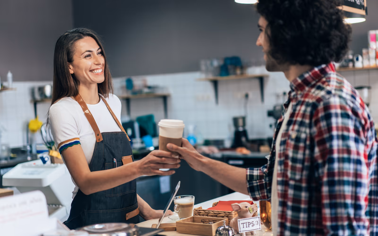 Barista smiling at customer