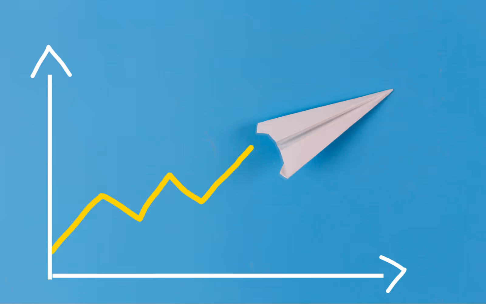 Two arrows resembling a graph, with a paper airplane tracking upward on it, with a blue background.