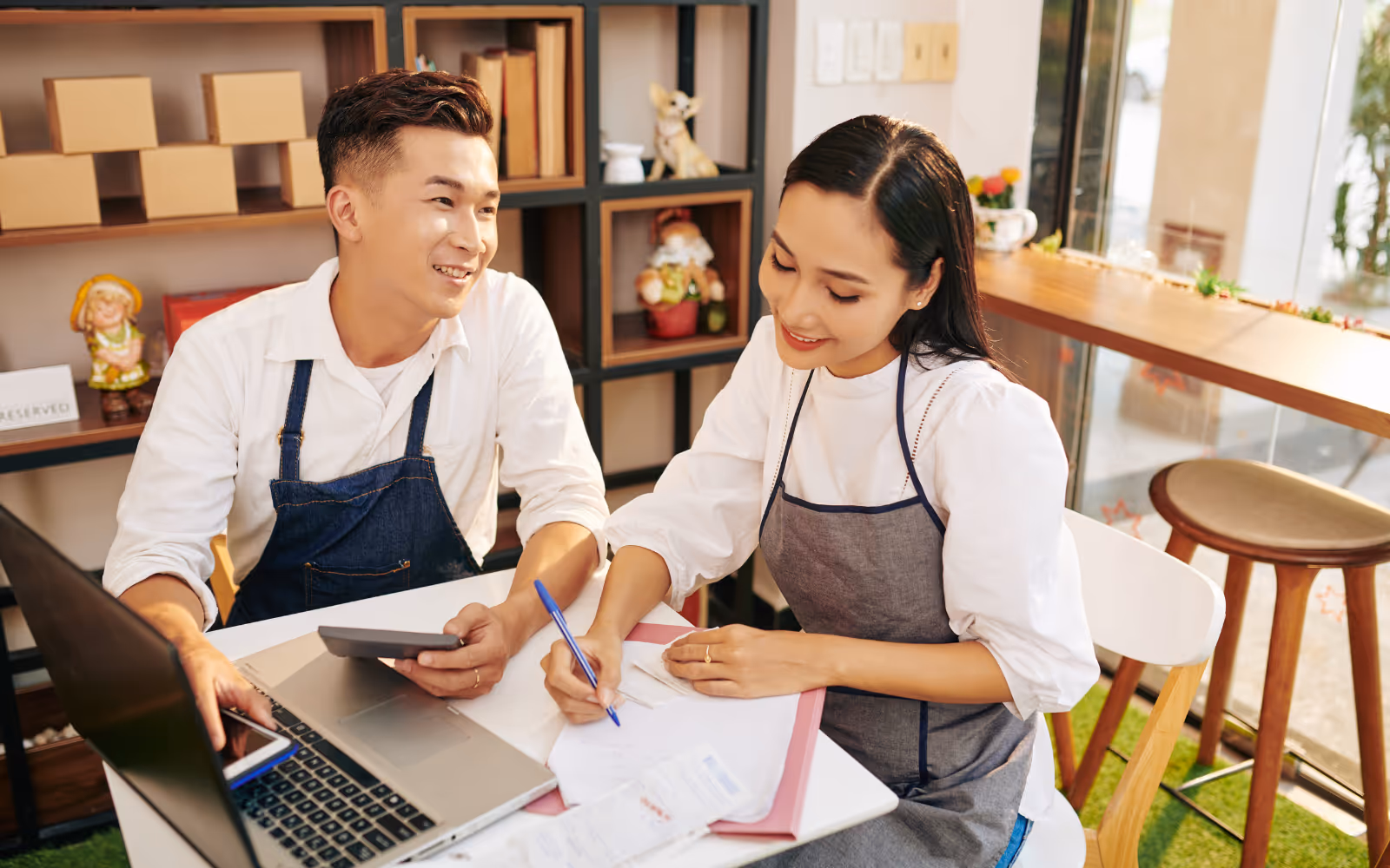 Small business owner using a laptop to manage their loyalty program online.