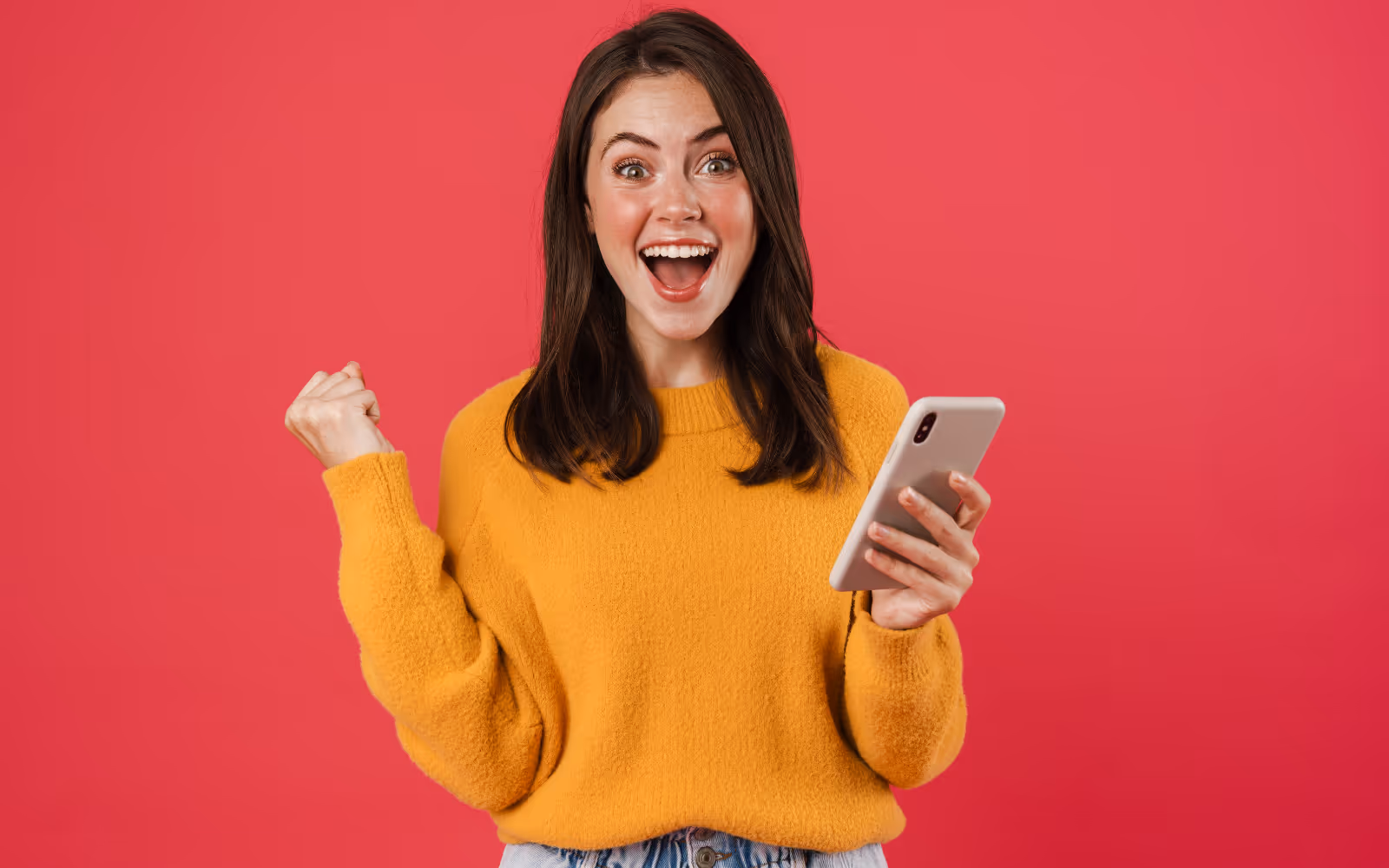 Excited person checking their phone for rewards or updates, possibly related to a restaurant loyalty program.