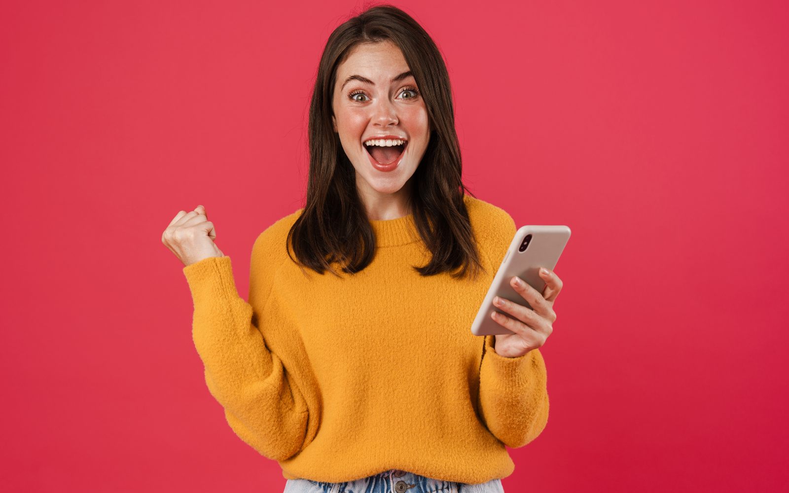 Excited person checking their phone for rewards or updates, possibly related to a restaurant loyalty program.