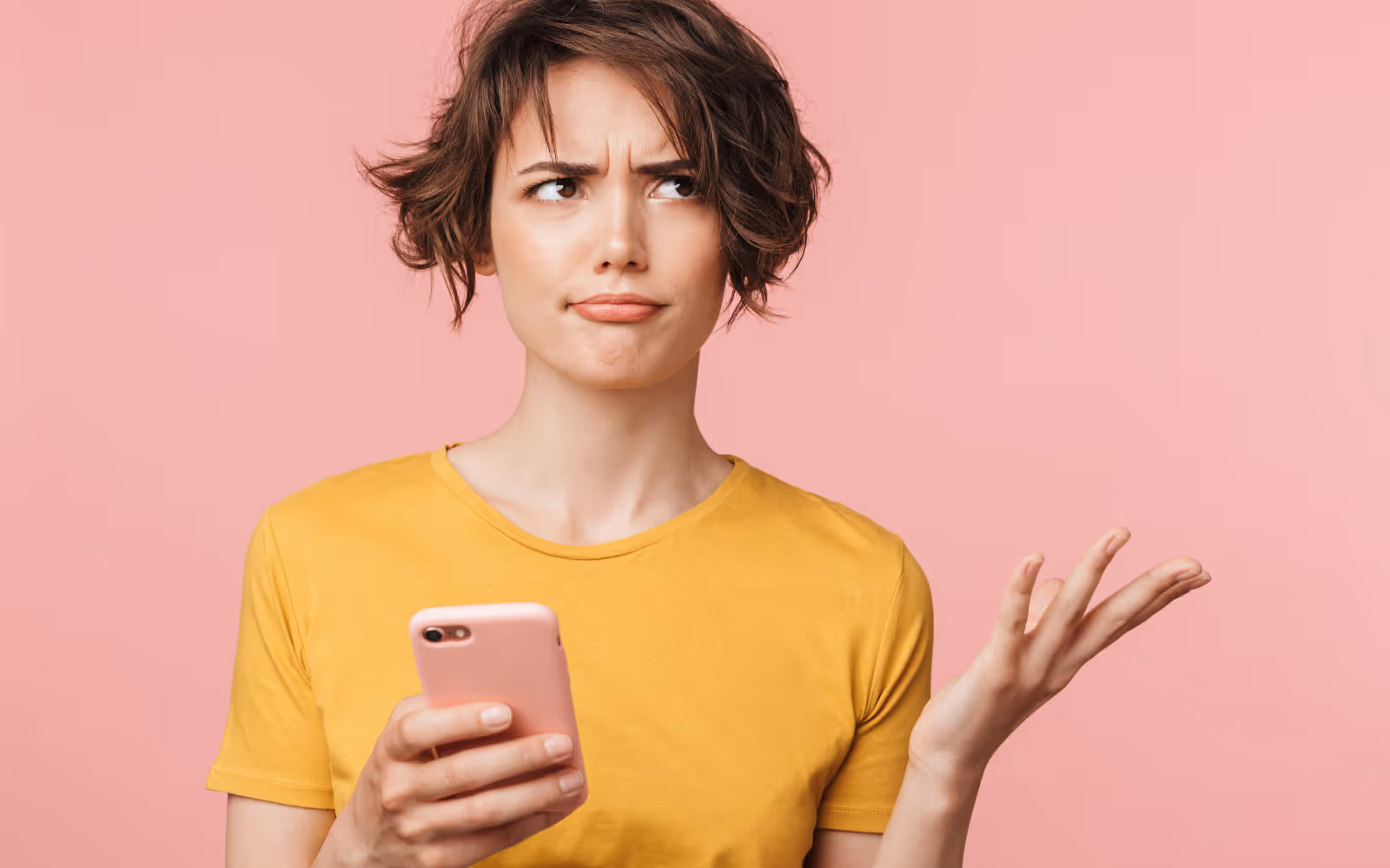 Person looking confused while using a loyalty app on a smartphone, illustrating challenges nutrition club members may face with digital rewards programs.