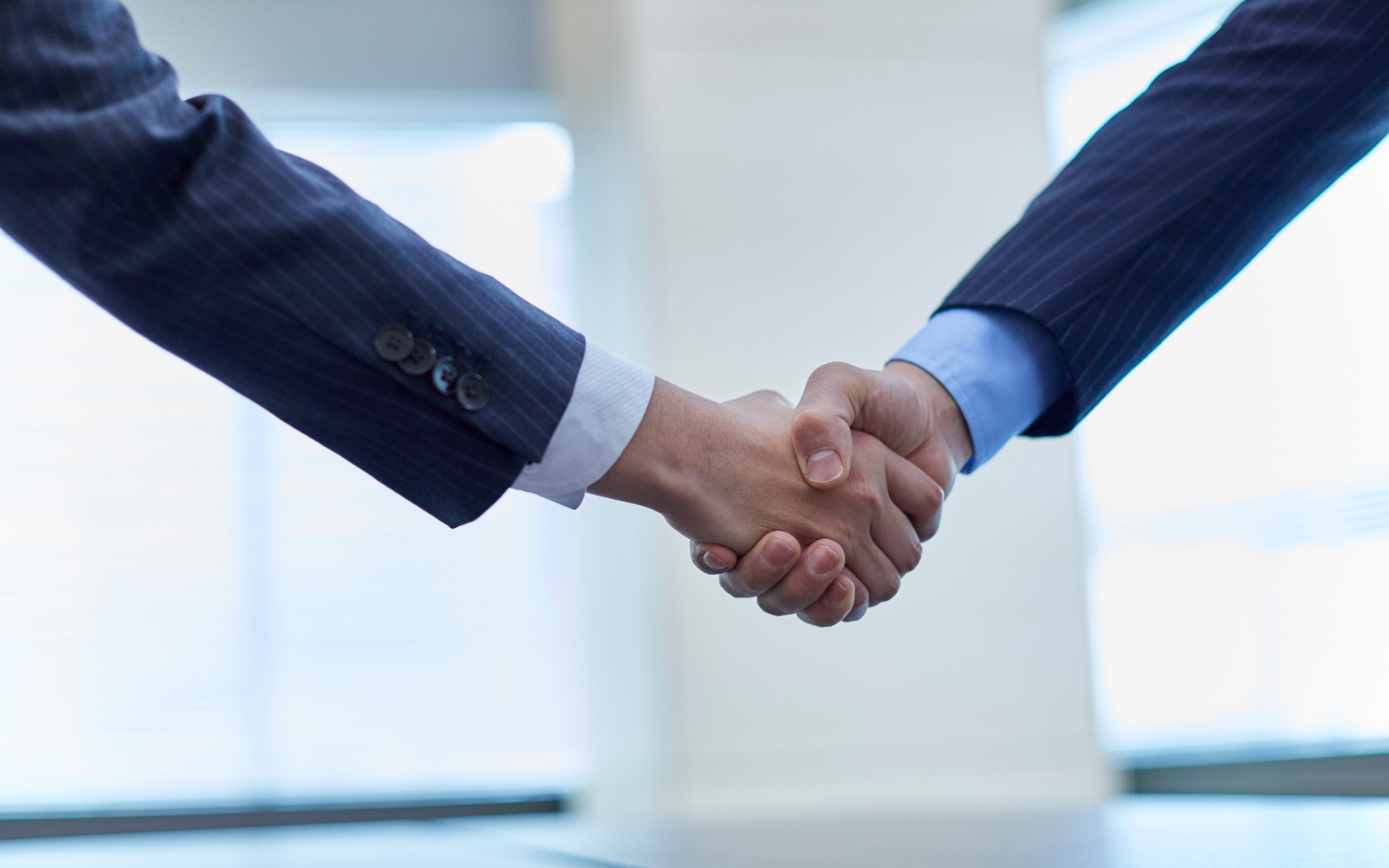 Handshake symbolising trust and loyalty between a business and its customers.
