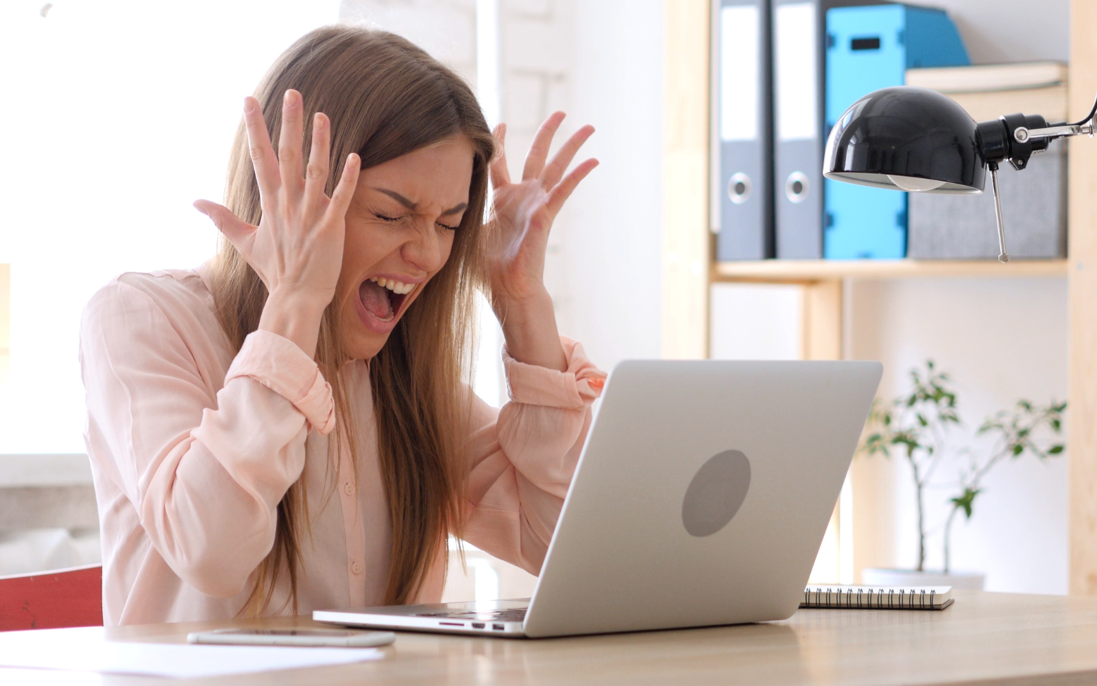 Frustrated business owner struggling with outdated paper punch card loyalty systems.