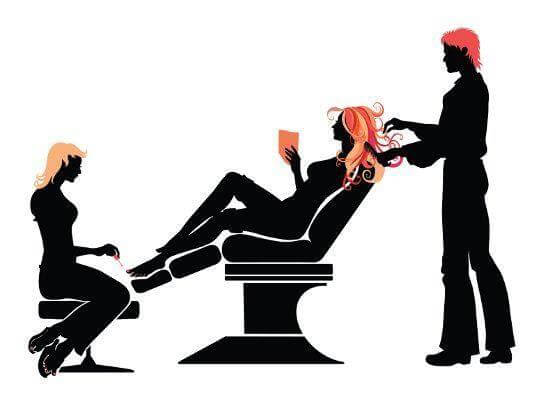 hairstylist and nail technician pampering valuable repeat customer in beauty salon