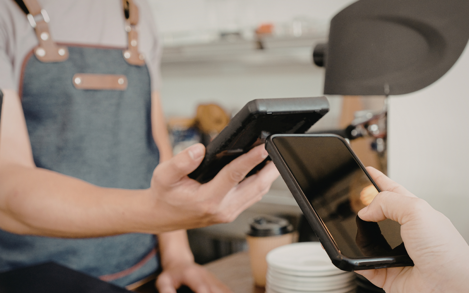 igital loyalty card stored on a smartphone at café checkout
