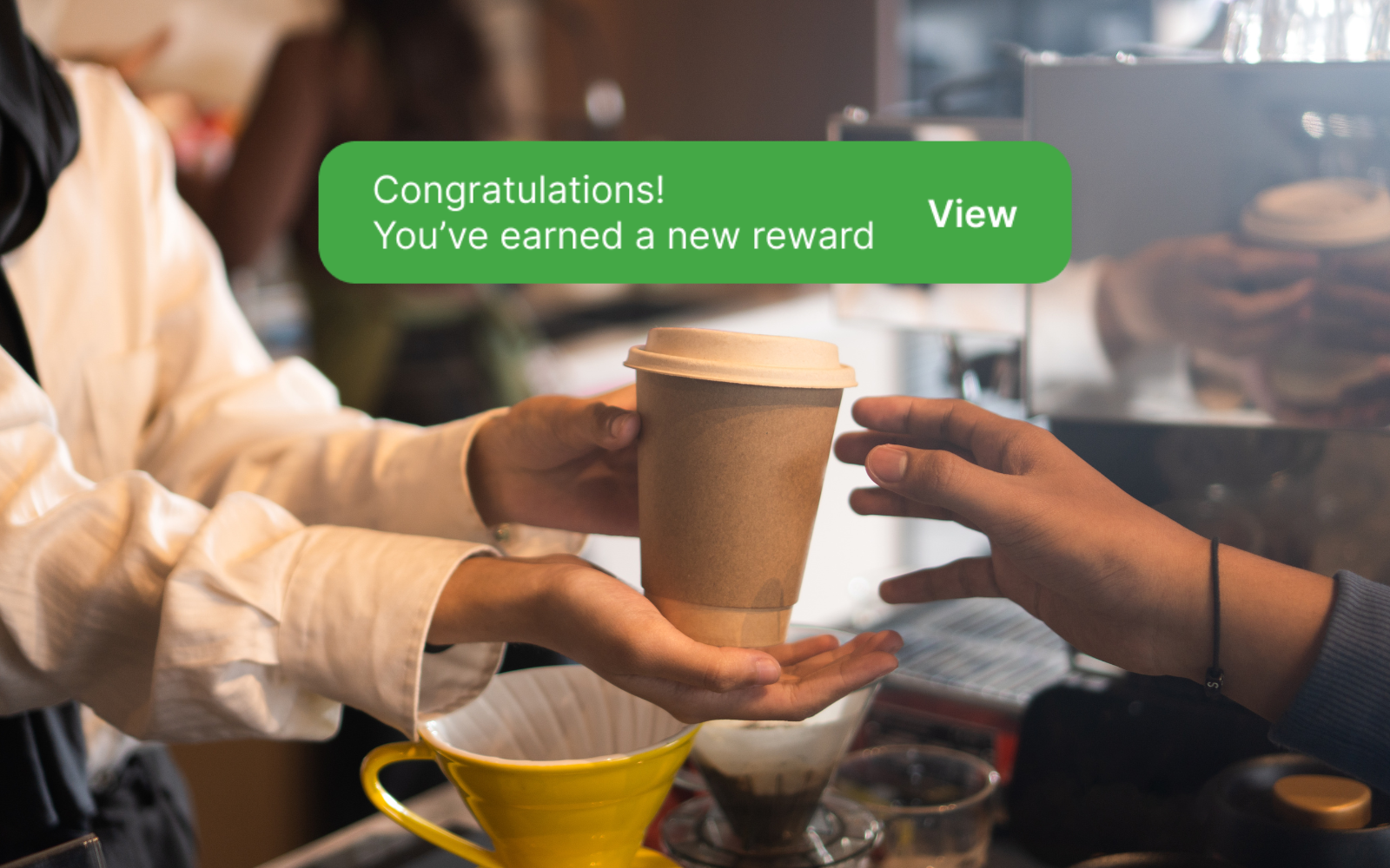 Australian café customer receiving a free coffee after completing a visit-based loyalty card.