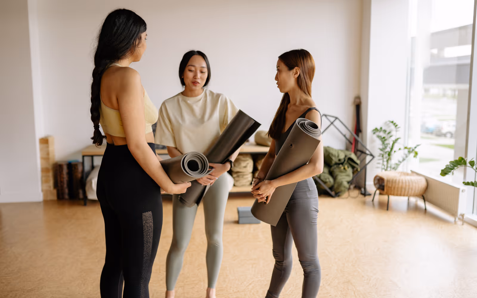 Group of yoga students participating in class, representing studio community and loyalty.