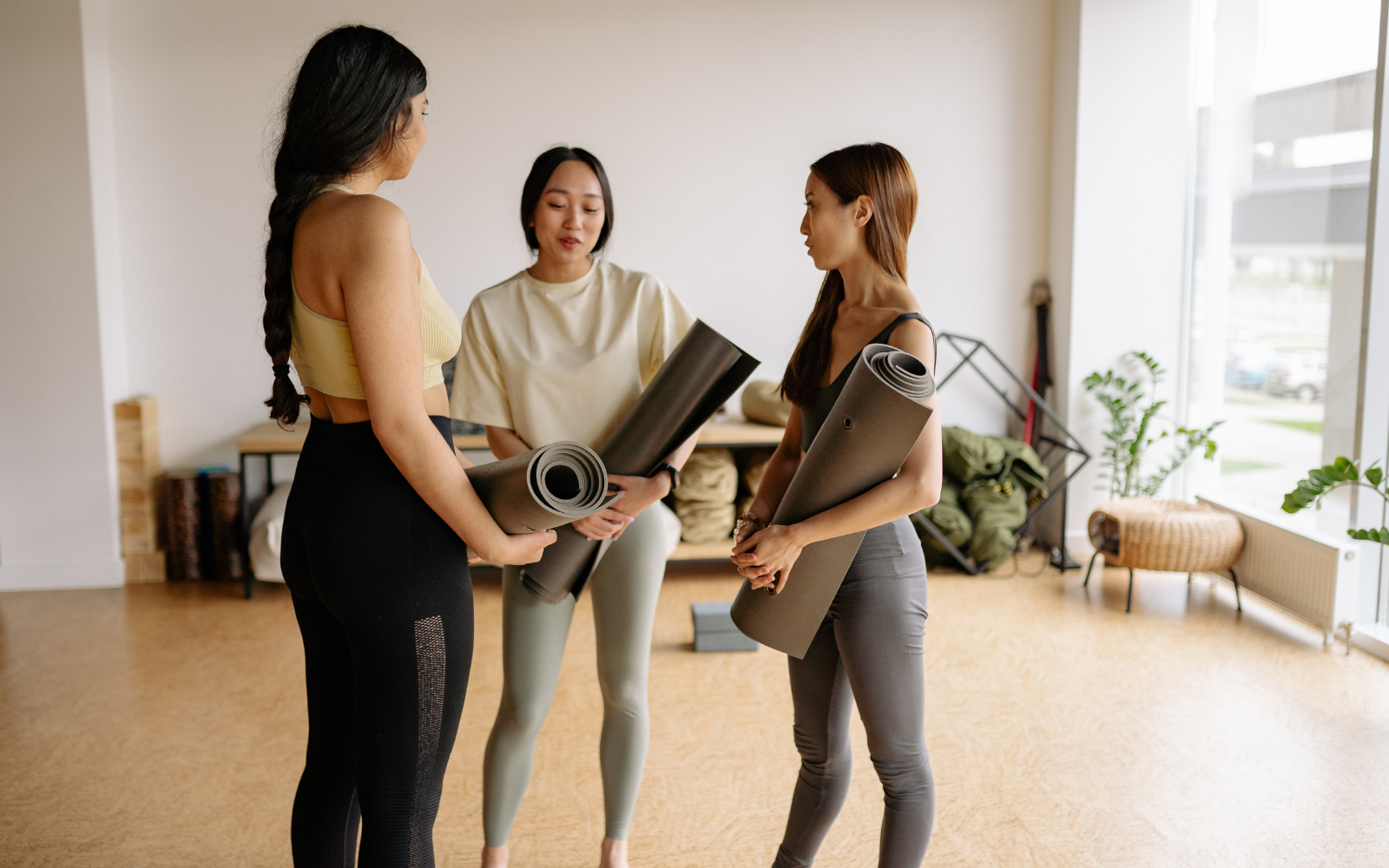 Group of yoga students participating in class, representing studio community and loyalty.