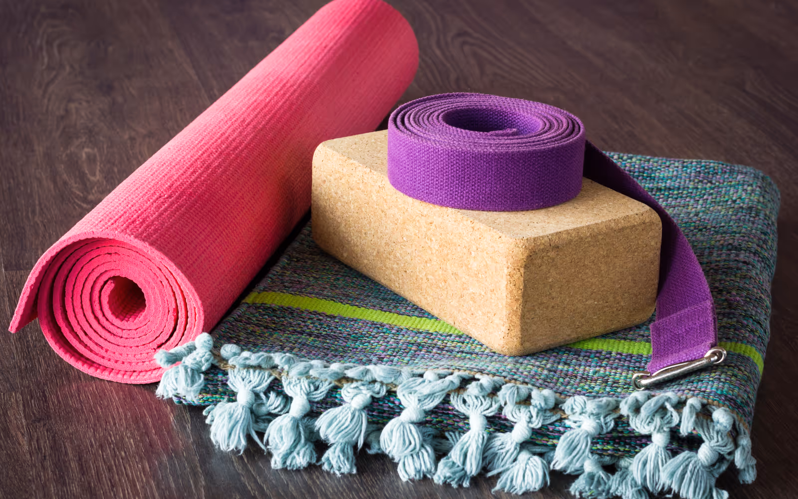  Yoga mats, water bottles, and merchandise offered as loyalty rewards in studio.
