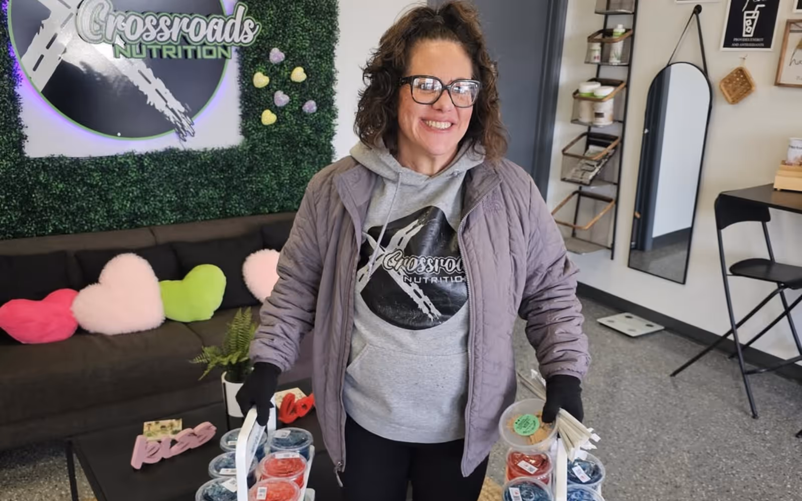 Crossroads Nutrition storefront and The Nook interior showing a multi-location smoothie shop using a shared digital loyalty program.