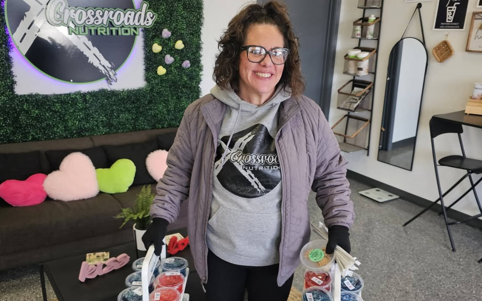 Crossroads Nutrition storefront and The Nook interior showing a multi-location smoothie shop using a shared digital loyalty program.