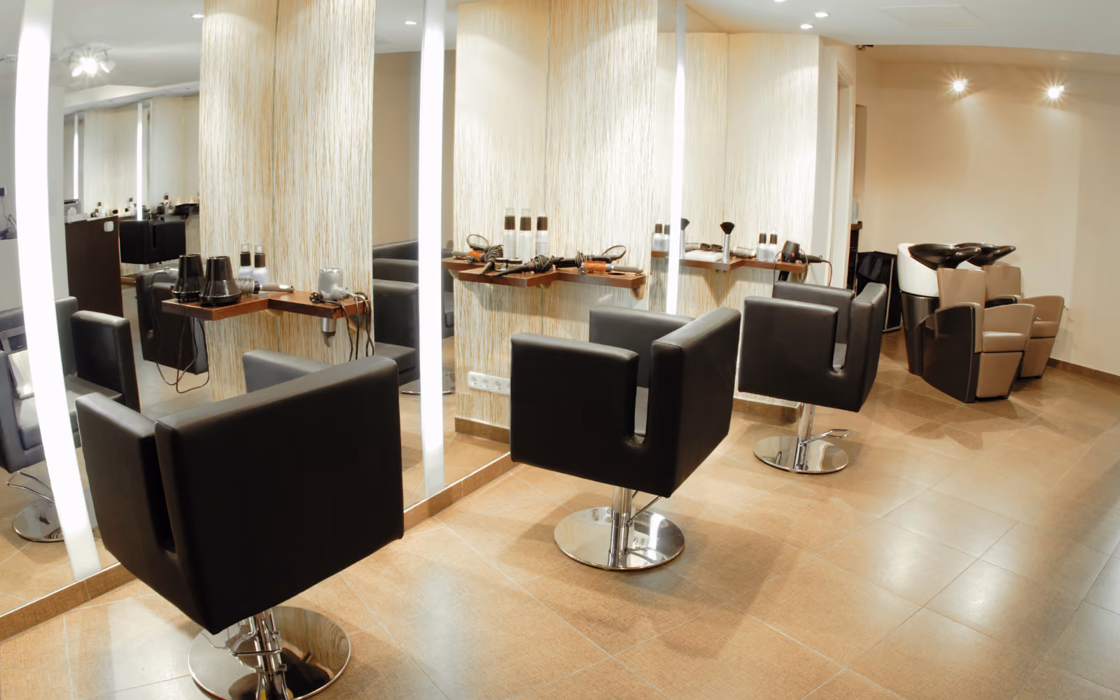 Australian hair salon owner using SMS follow-up tools to improve salon client retention and rebooking rates.