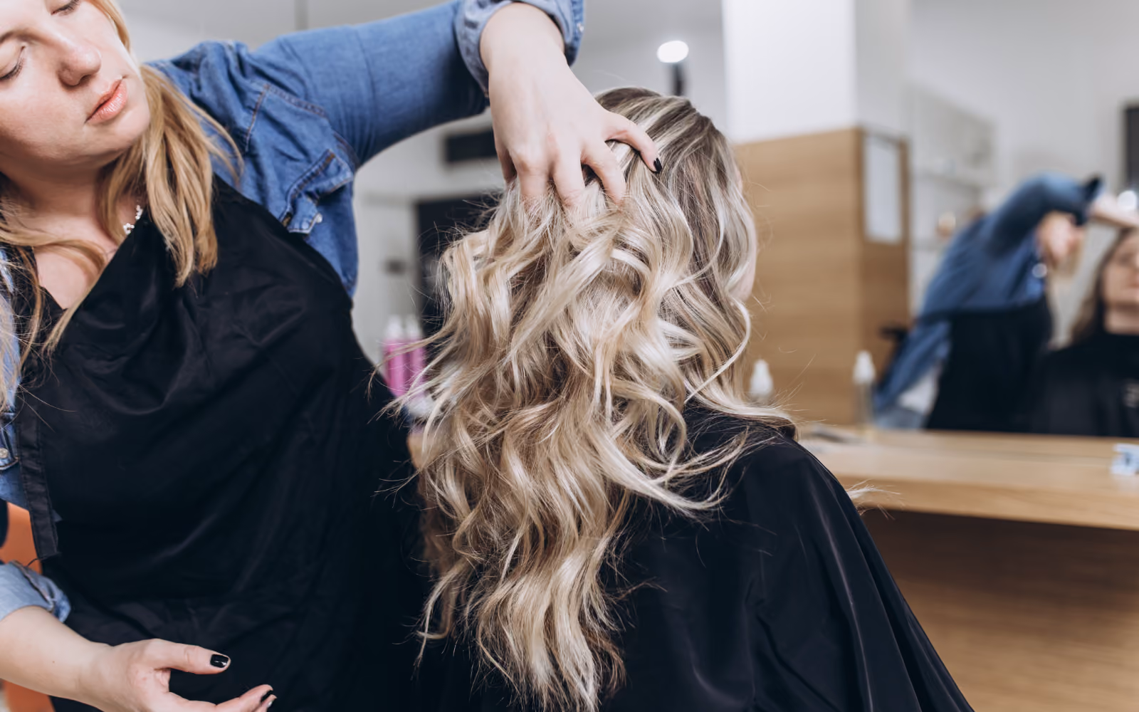 Beauty salon client receiving a personalised birthday reward as part of a salon loyalty program in Australia.