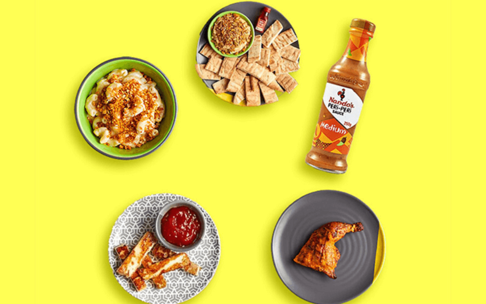 Customers using the Nando's PERi-Perks loyalty program through the Nando's mobile app at a restaurant location.