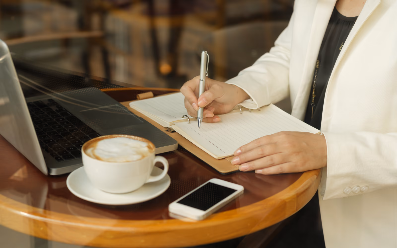 Cafe founder planning a new coffee shop before opening.