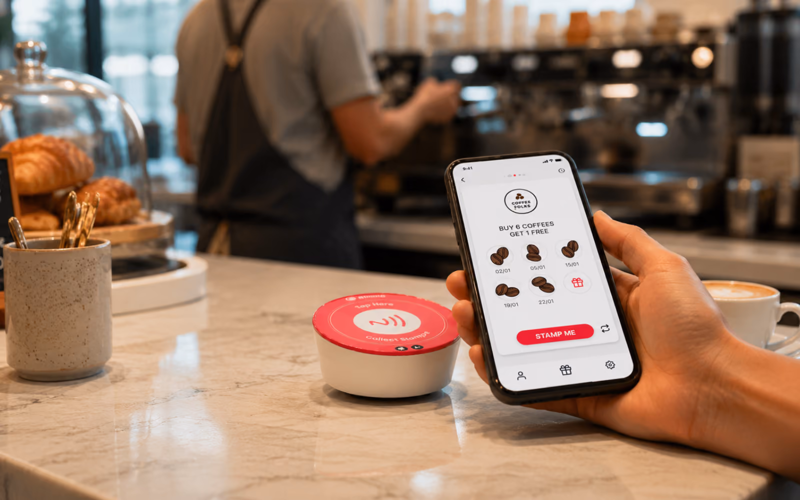 Customer using a digital loyalty program at a cafe.