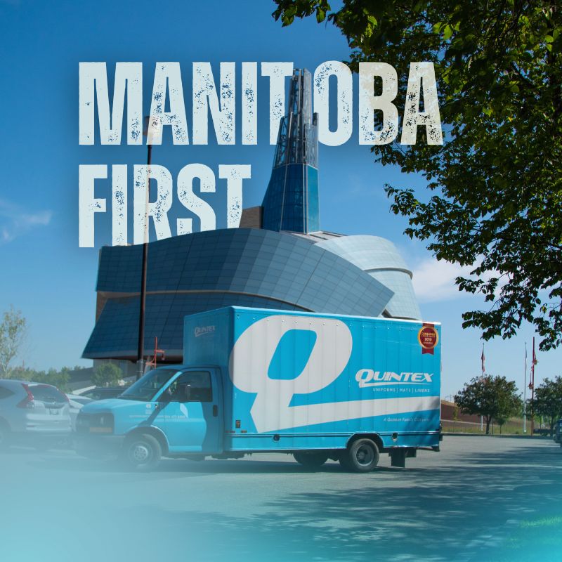 quintex truck parked at a parking lot, with the Human Rights Museum in the background