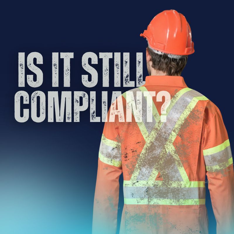 a person wearing a hi-vis uniform that is covered with dirt