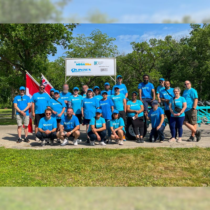 Corry (3rd from left- second row) with other Q-Crew members participating in MegaBike in support of Big Brothers Big Sisters.