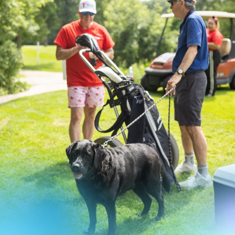 David Quinton with Gabby at the Mutt & Masters Golf Classic.
