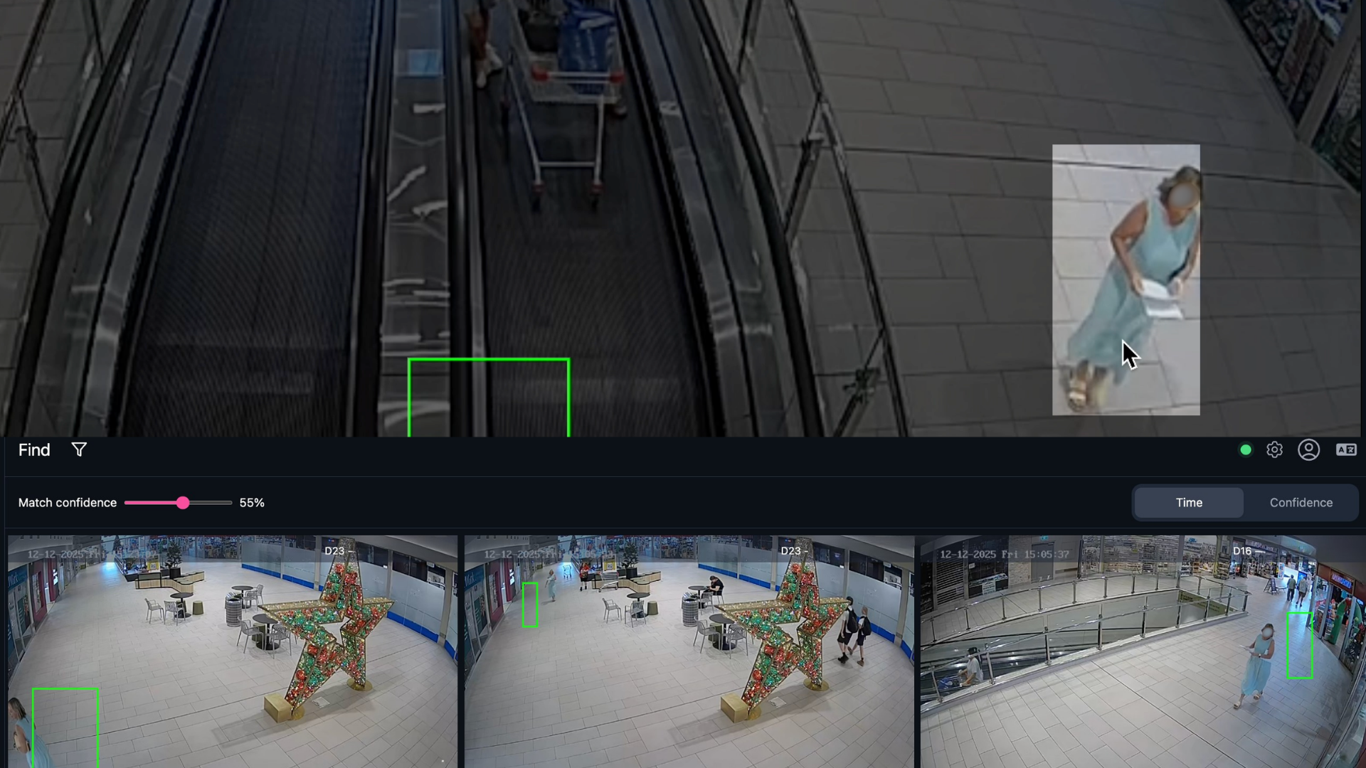Surveillance screen showing multiple camera views of a mall with a large decorative star and people walking.