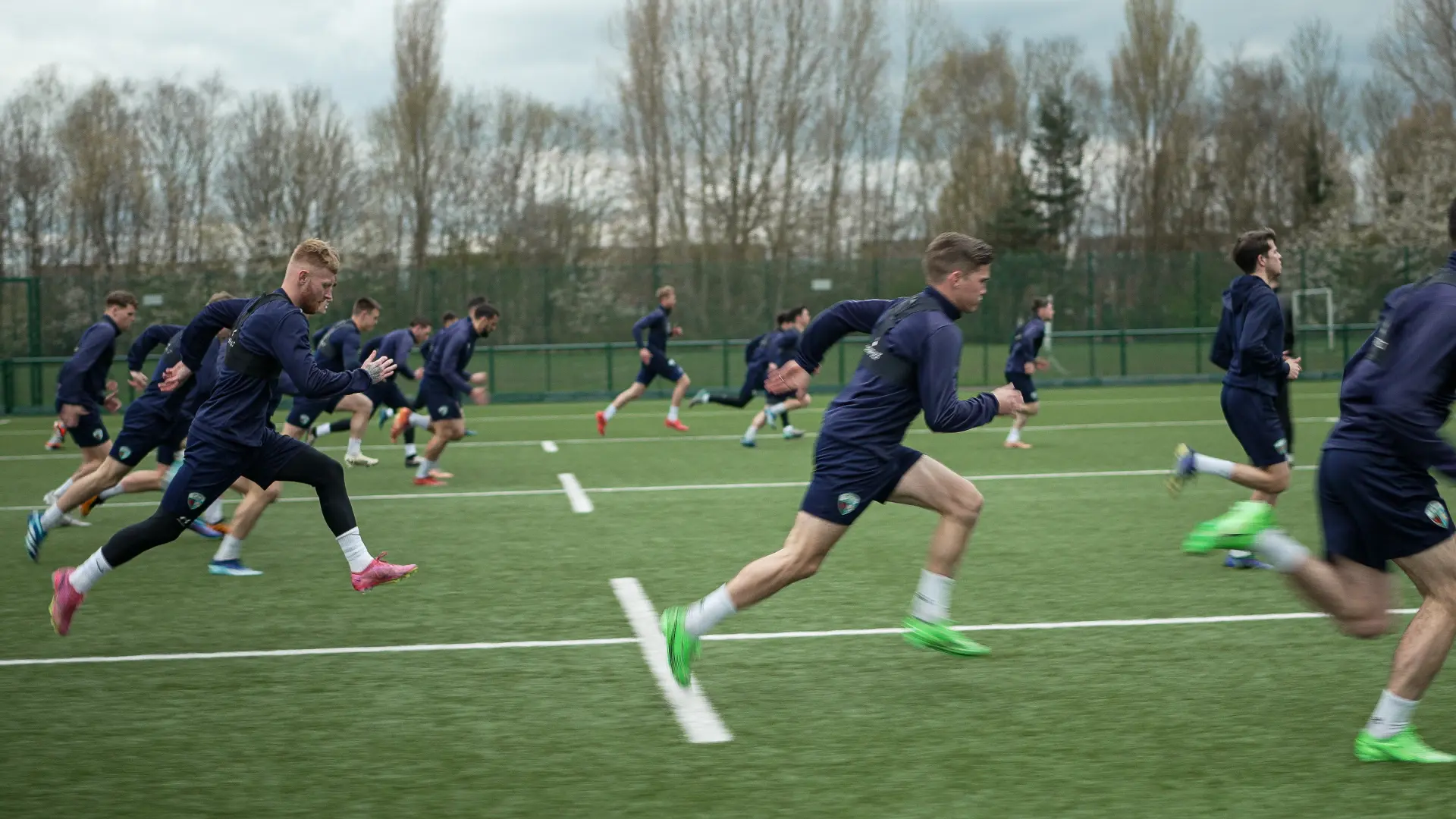Men running on a football field