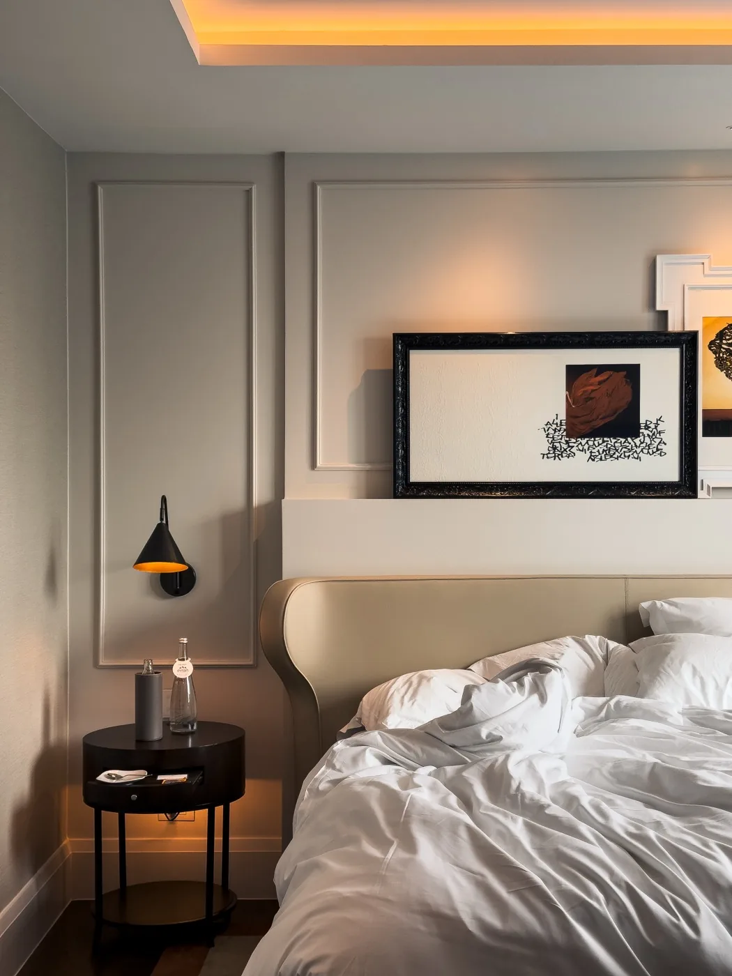 Guest room with artwork above the bed at Sofitel Bangkok
